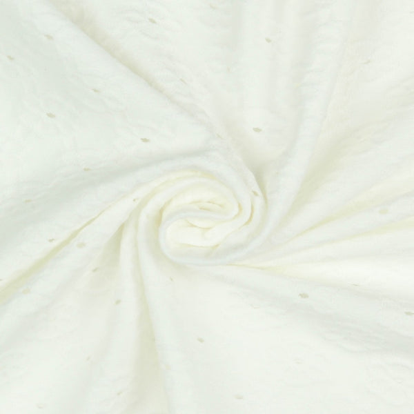 Jersey uni blanc - ajouré de petites fleurs - imitation broderie anglaise (prix pour 10cm)