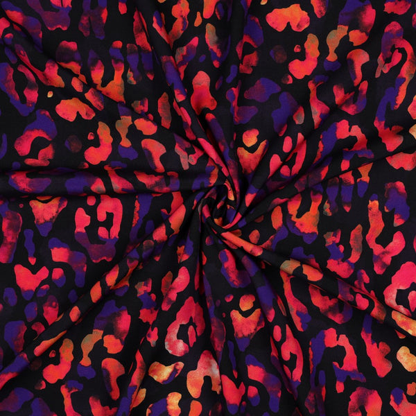 Viscose léopard couleurs vives sur fond noir certifiée oeko-tex (Prix pour 10cm)