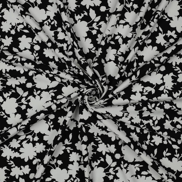 Viscose stretch "Pluie de fleurs sur fond noir" (Prix pour 10cm)