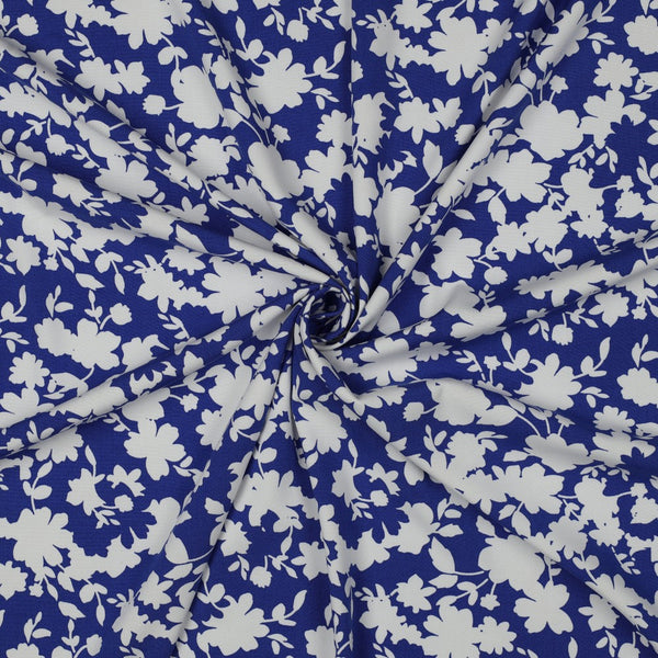 Viscose stretch "Pluie de fleurs sur fond bleu cobalt" (Prix pour 10cm)