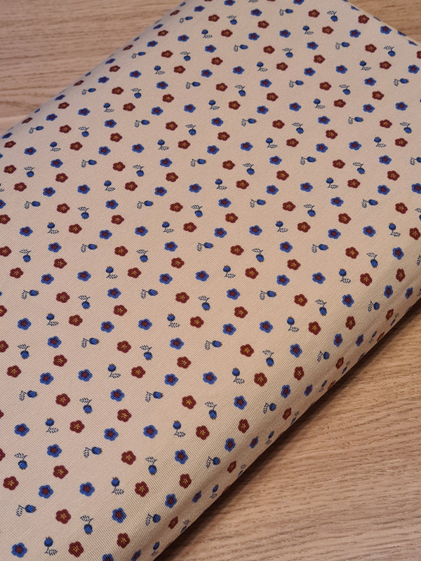 Coupon de 1,5m de Jersey Fleurettes rouges et bleues sur fond beige - certifiée Oeko-tex (prix pour le coupon)