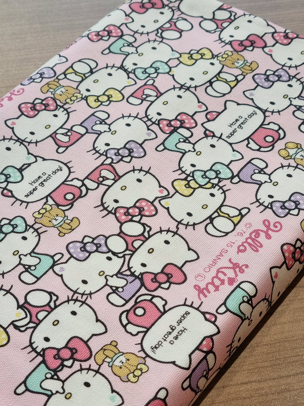 Coupon de 60cm de Canvas Hello Kitty - fond rose - Licence Sanryo (prix pour le coupon)