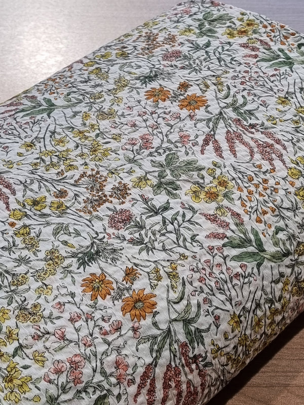 Cotton lawn gaufré japonais tons jaunes/orangés sur fond blanc (prix pour 10cm)