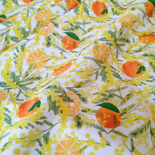 Tissu 100% coton "mimosa et oranges sur fond blanc" certifié Oeko Tex (prix pour 10cm)
