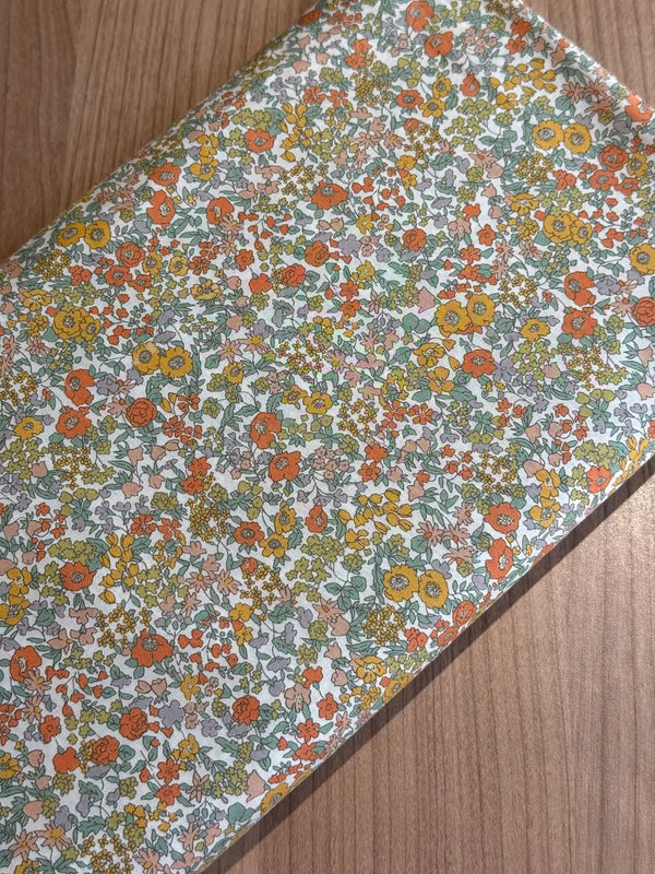 Cotton lawn "Fleurs sauvages tons jaune orangé" de marque Hokkoh (prix pour 10cm)