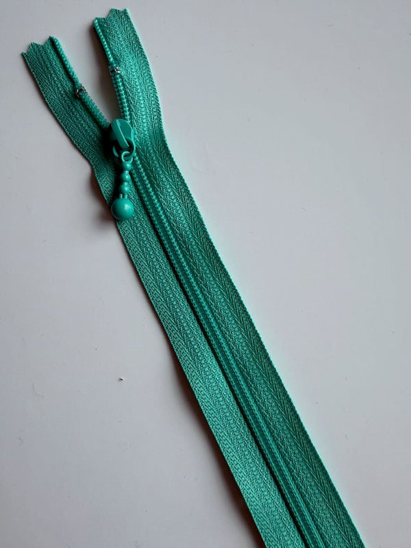 YKK - zip non séparable 20cm avec curseur décoration boule - couleur lagon 049  (prix à la pièce)