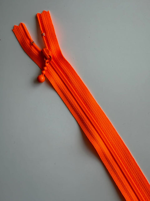 YKK - zip non séparable 20cm avec curseur décoration boule - couleur orange fluo  (prix à la pièce)
