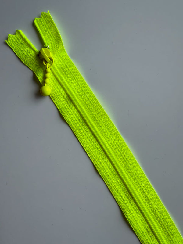 YKK - zip non séparable 20cm avec curseur décoration boule - couleur jaune fluo (prix à la pièce)