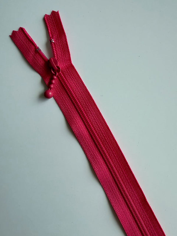 YKK - zip non séparable 20cm avec curseur décoration boule - couleur fuchsia 516 (prix à la pièce)