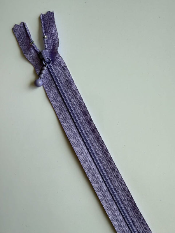 YKK - zip non séparable 20cm avec curseur décoration boule - couleur parme 553 (prix à la pièce)