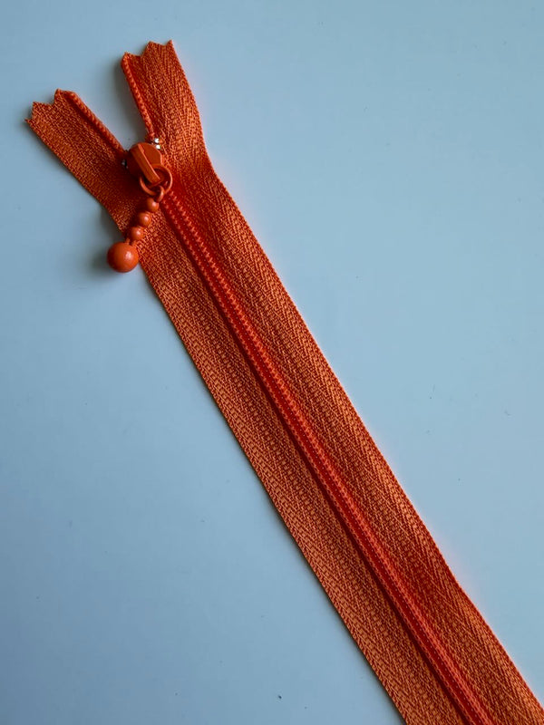 YKK - zip non séparable 20cm avec curseur décoration boule - couleur orange 523 (prix à la pièce)