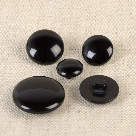 Boutons à pied de 22mm - noir (prix à la pièce)
