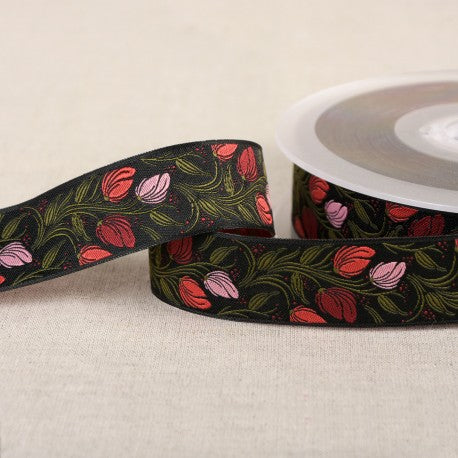 Galon en jacquard fleuri sur fond noir - 24mm (prix au mètre)