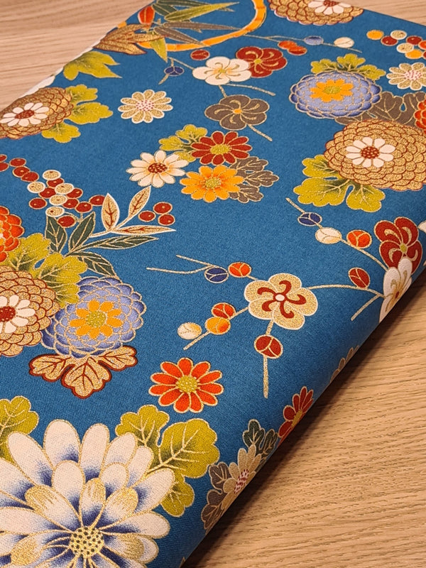 Tissu Chrysanthèmes dorés sur fond bleu (prix pour 10cm)