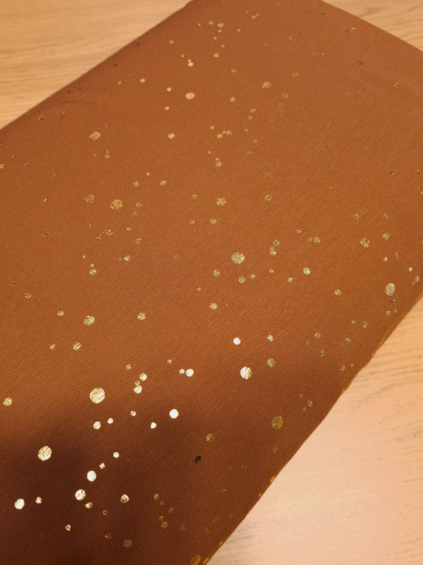Jersey pluie scintillante dorée sur fond chocolat - certifié Oeko-tex (prix pour 10cm)