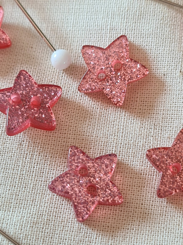 Boutons Etoiles roses et pailletées 11mm (prix à la pièce)