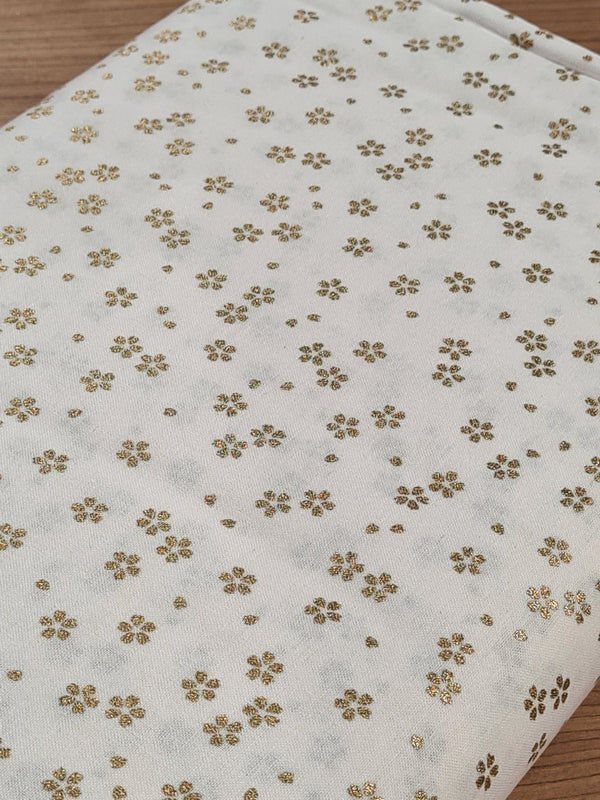 Tissu Fleurs de cerisiers dorées sur fond blanc (prix pour 10cm)
