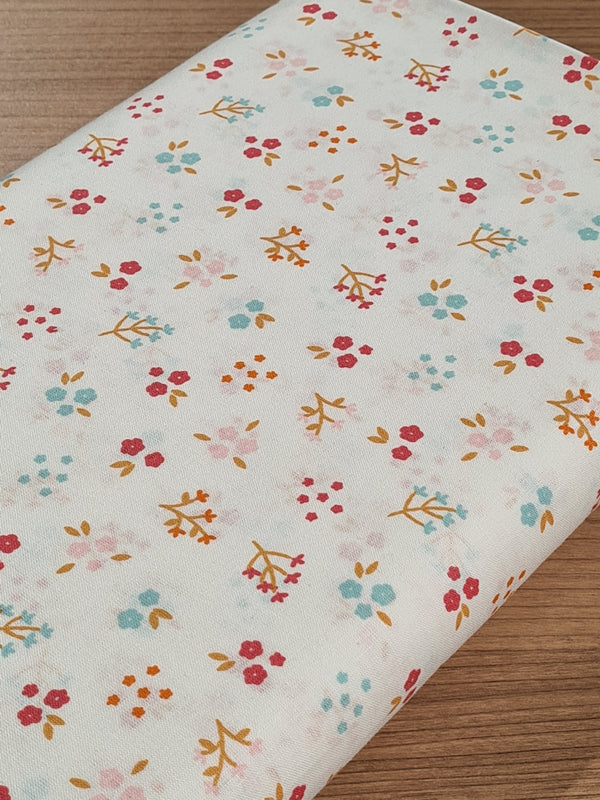 Popeline 100% coton "jolies fleurs" sur fond blanc certifié GOTS (prix pour 10cm)
