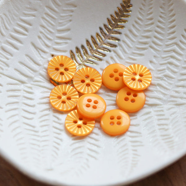 Boutons pâquerettes Lise Tailor de 12mm -  couleur jaune (prix à la pièce)